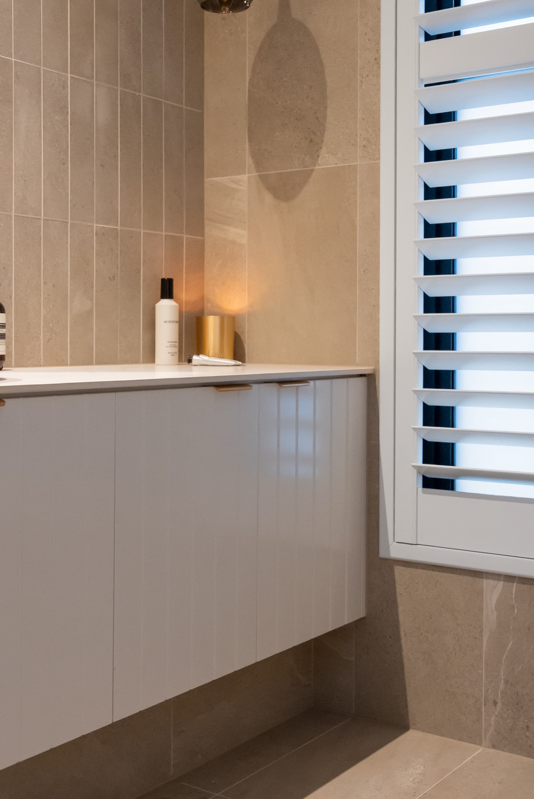 White vanity with fluted detail