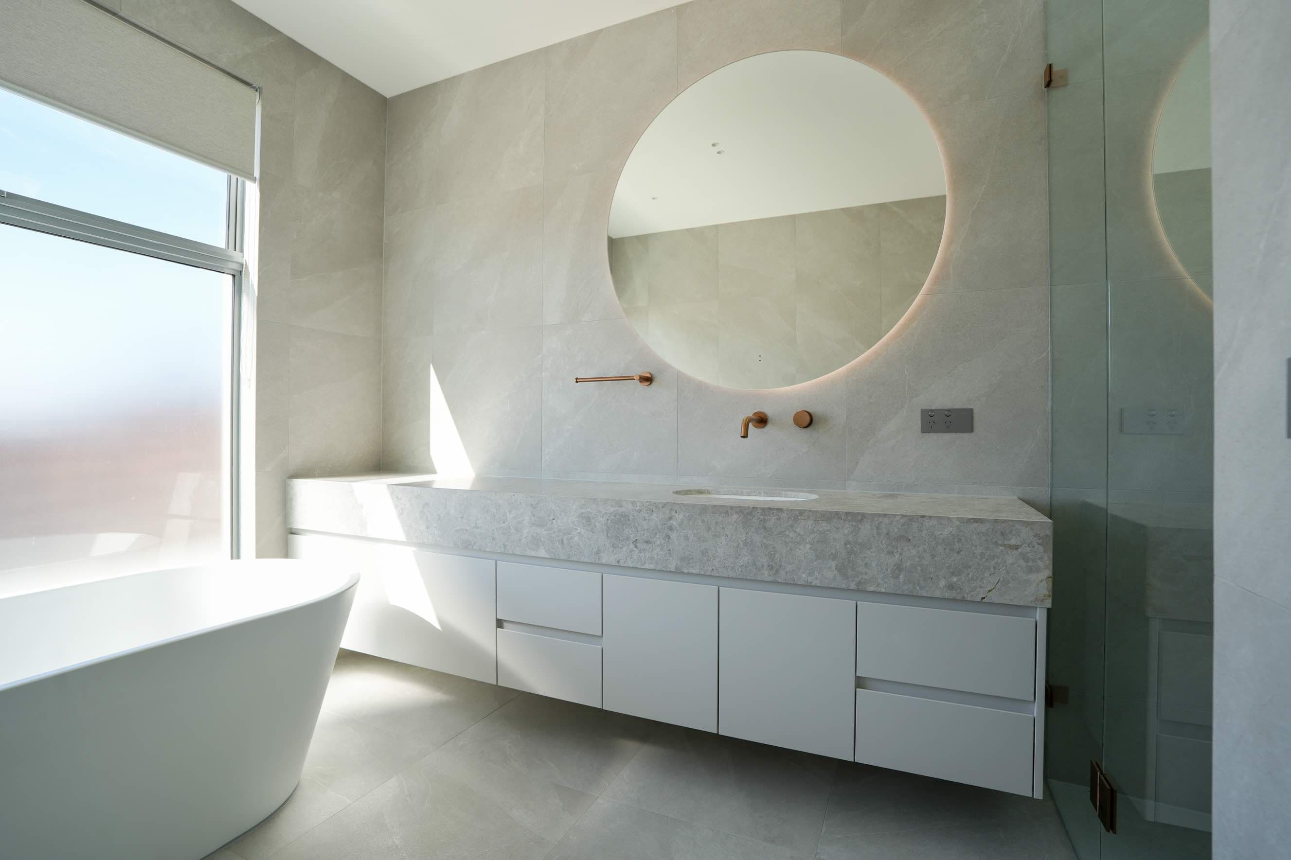 Luxury bathroom with freestanding bath and custom vanity
