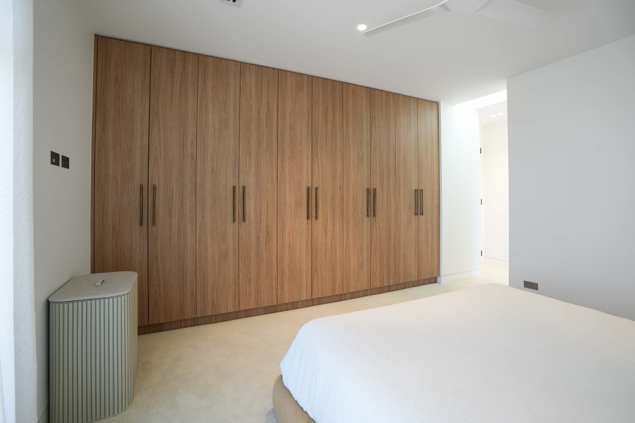 Full wall timber wardrobe in bedroom