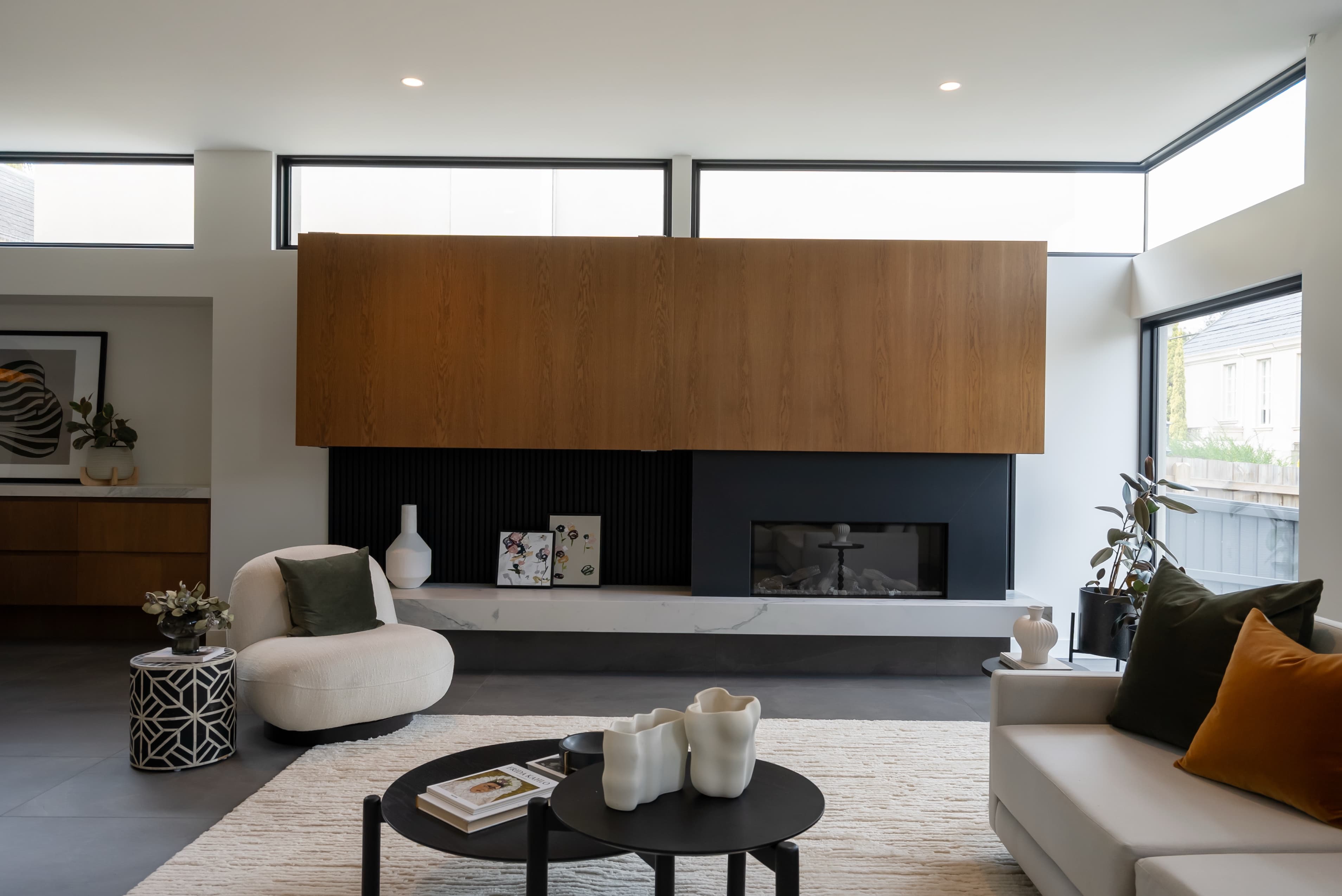 Contemporary living room with custom fireplace surround