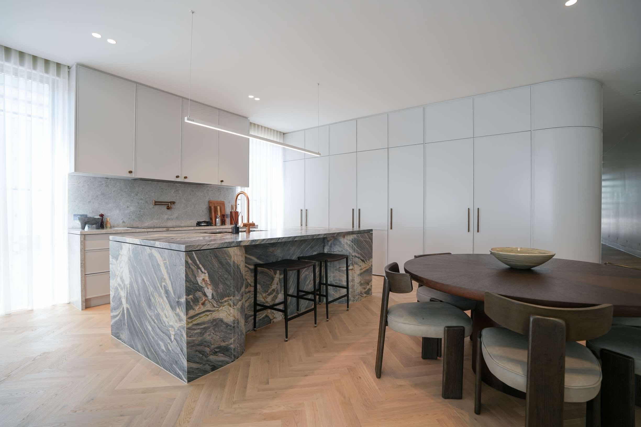 Modern kitchen with marble island and custom cabinetry