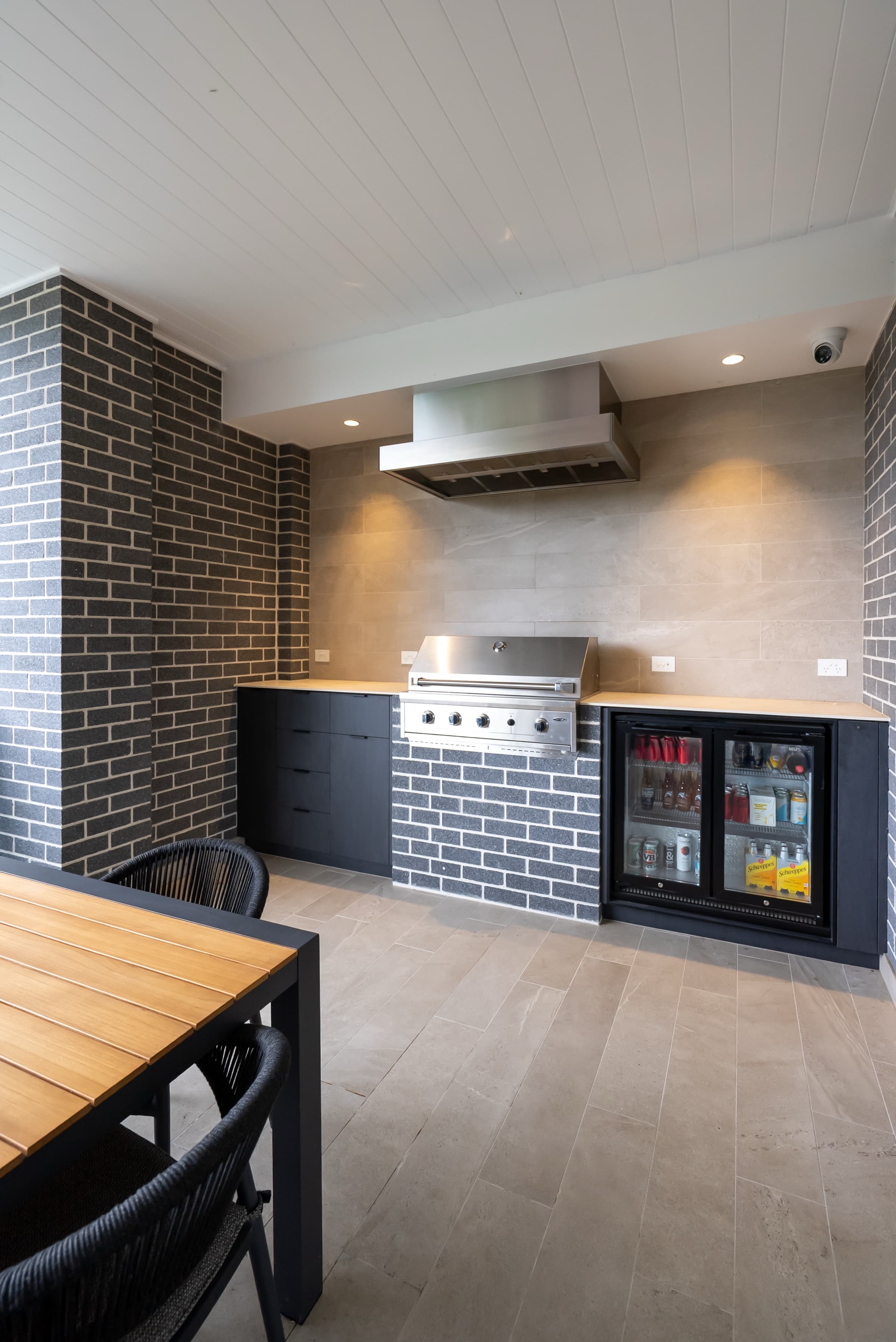 Outdoor alfresco kitchen with BBQ and bar fridge